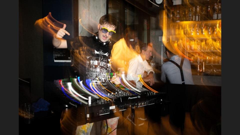 A passionate DJ at an event setting the music beats and having fun - Event photographer, Tokyo Event Photography