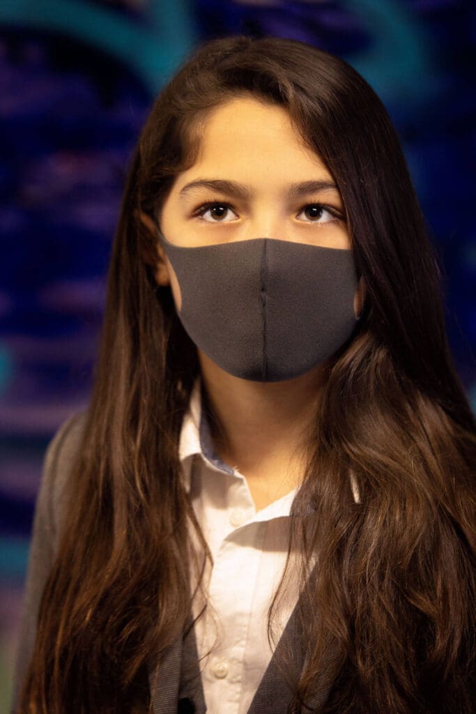 A young woman in simple business attire & a mask, with her straight hair open - Tokyo Portrait Photographer, Headshot photos